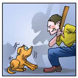 Un uomo tenta di colpire un cane con un bastone.
